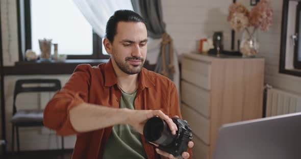 A Young Handsome Man Checks the Camera Lens