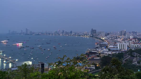 Pattaya bay and Bali Hai Pier, from viewpoint, Chonburi, Thailand; day to night - Time Lapse