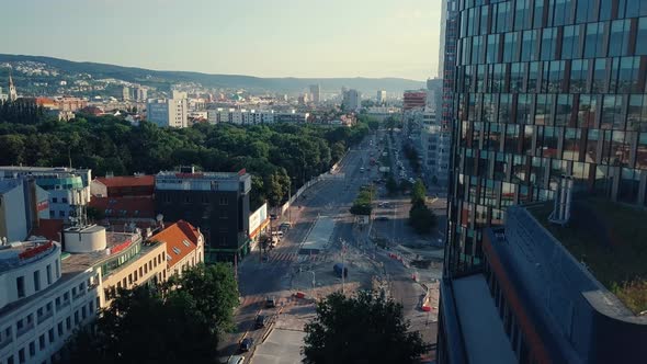 Forward drone shot above Karadzicova street, Bratislava, on a sunny evening alt