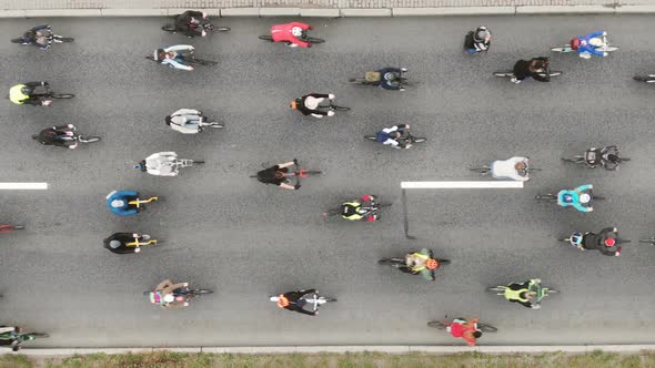 Cyclists Participate in Race and Ride Along Asphalt Road alt