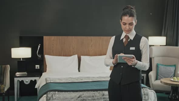 Hotel Manager with Tablet in Room alt