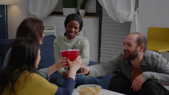 Multicultural Friends Cheering Bottles of Beer Spending Time Together alt