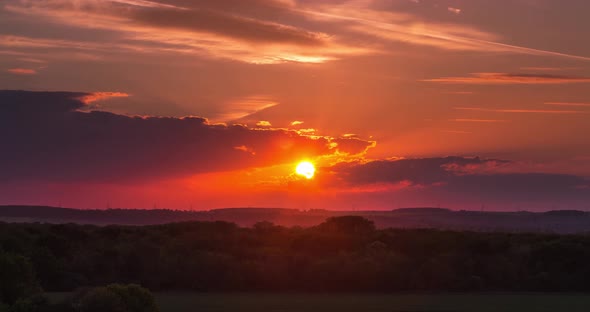 Sunset Behind Clouds Over Rural Woodland Time Lapse