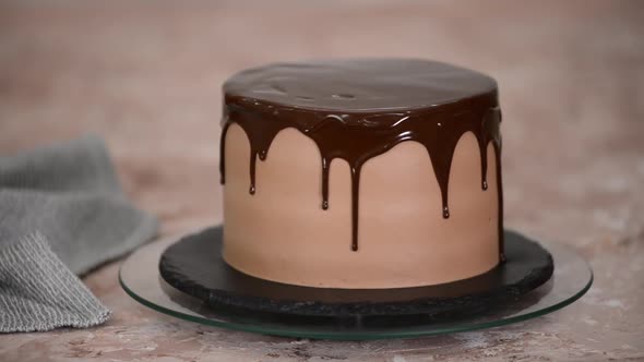 Chocolate Cake with Glaze Rotates on the Rotating Stand