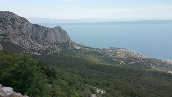 Alpine Dangerous Road Against the Backdrop of the Sea Coast of Croatia Location Biokovo