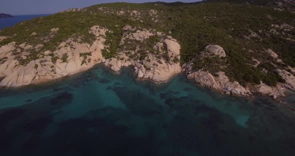 Sardinia Island And Its Rocky Shore With Mediterranean Vegetation