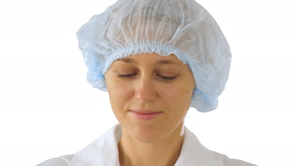 Wear the Mask! Female Doctor Wearing a Mask and Pointing Her Finger Up on White Background alt