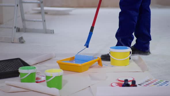 Painted Put Down Construction Roller Into Paint Tray To Renovate Painting Walls