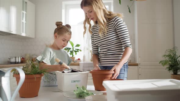 Video of mother and daughter doing compost. Shot with RED helium camera in 8K alt