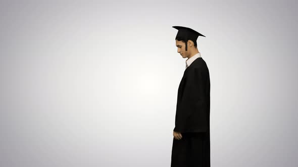 Male Graduate Walking in the Frame, Throwing His Mortarboard and Doing a Handspring on Gradient alt