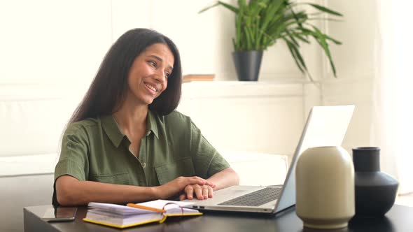 Optimistic Indian Female Student Using Laptop for Video Connection alt