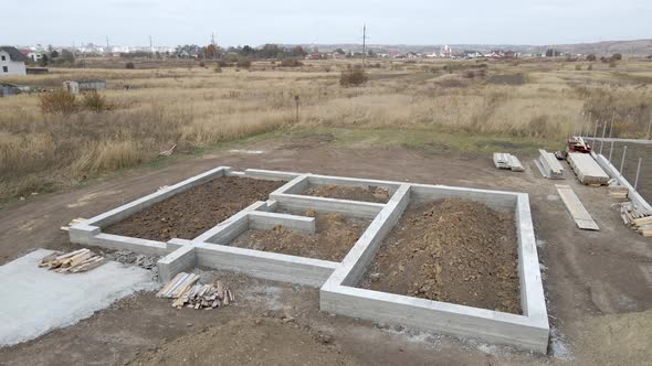 Top Down Aerial View of Building Works of New House Concrete Foundation on Construction Site alt