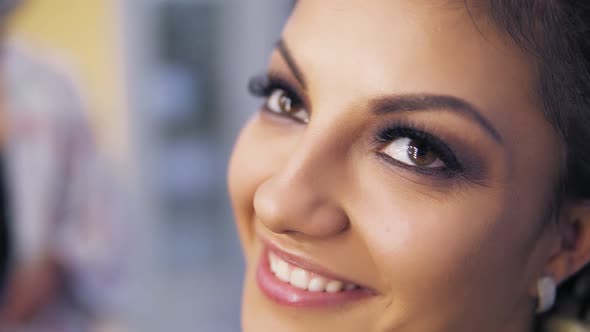 Closeup of Attractive Young Woman with Beautiful Makeup Smiling at Camera alt