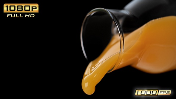 Pouring Orange Juice out of a Bottle alt