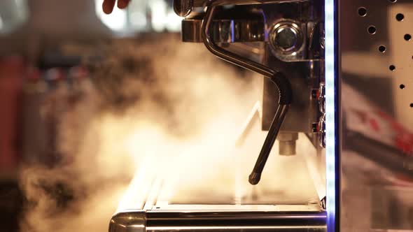 Coffee shop small business concept. Flow of steam from professional espresso coffee machine