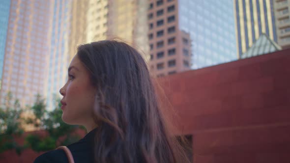 Closeup Cute Woman Look Back on City Building alt