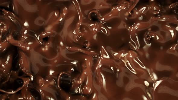 Super Slow Motion Detail Shot of Splashing Melted Chocolate at 1000 Fps alt