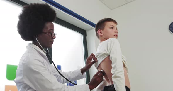 Black African Woman Doctor And Child alt