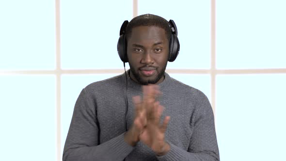 Handsome Man in Headphones Is Listening To Music. alt