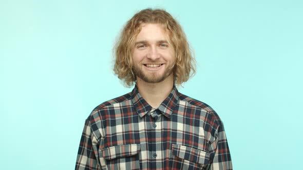 Slow Motion of Attractive Blond Man with Beard Wearing Casual Checked Shirt Laughing and Smiling