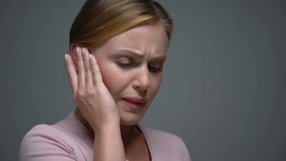 Woman Suffering From Earpain, Inflammation or Infection of Ear, Otitis, Template