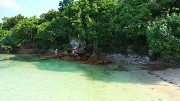 Aerial top down abstract of beautiful seashore beach trip by shallow ocean and white sand background alt