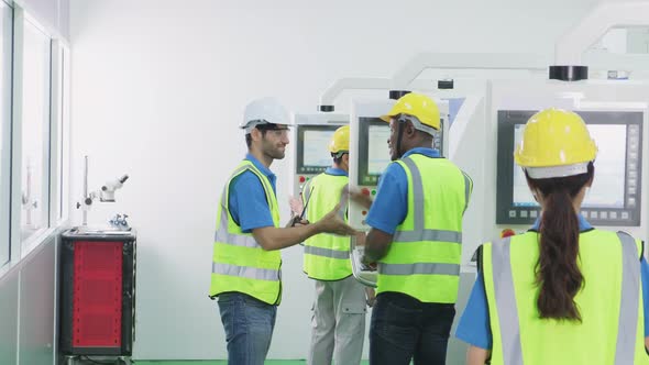 Group of interracial worker people wearing protective safety equipment helmet and work in factory. alt