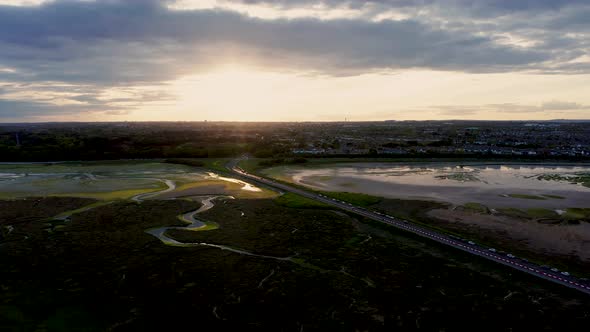 Drone rising over the Irish landscape at golden. alt