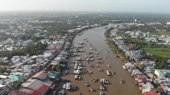Aerial: flying over Cai Rang floating market in the morning, Can Tho, Vietnam alt