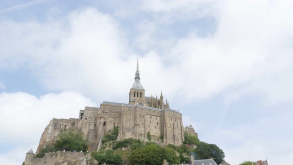 Beautiful Mont Saint Michel  by the day in Normandy France 4K 3840X2160 UHD slow tilt video - Abbey  alt
