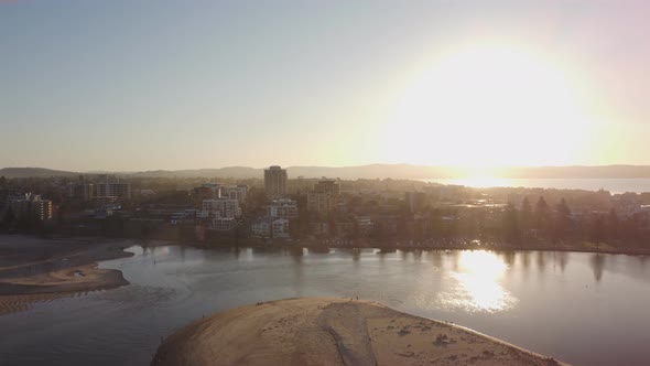 ascending aerial shot of the entrance at sunset alt