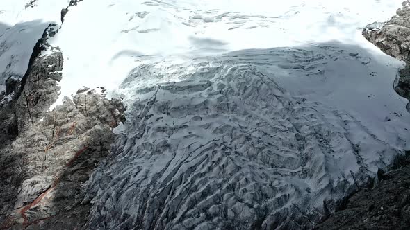 A glacier in the Peruvian Andes is shrinking and melting caused by climate change and global warming alt