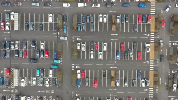 Aerial footage above a busy car park taken in the winter time in the town of Colton in Leeds alt
