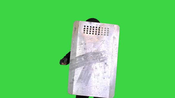 Riot Police Unit with the Shield Up and Baton Moving Towards Camera on a Green Screen Chroma Key alt