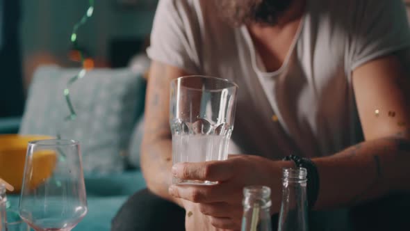 Crop Man Taking Hangover Pill alt