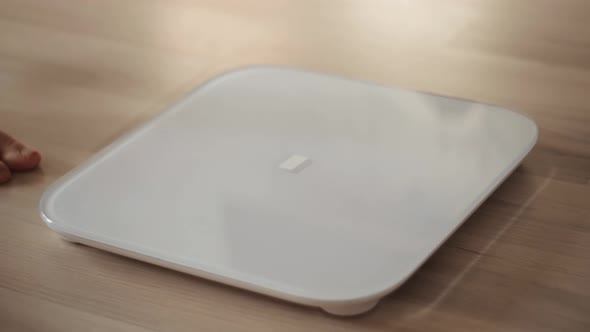 Woman On Weight Scale.Weight Scale On Floor.Girl Measuring Weight On Health Scale.Fat Overweight alt