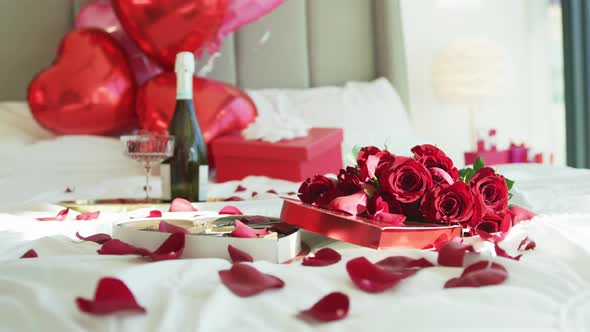 Beautiful Bed Full of Rose Petals Celebrating Valentines Day Engagement 6K alt