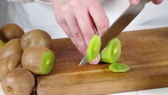Close-up video of cutting kiwi