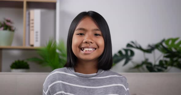 Girl smile and look at camera. alt