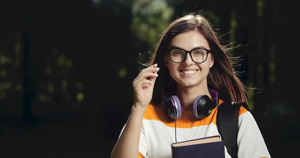 Young Female Student Portrait in Park