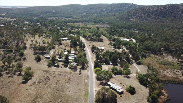 Aerial flying slowly towards the historic gold mining town of El Dorado, in Victoria Australia alt