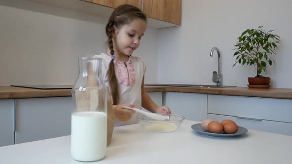 Little Girl Learns To Cook in the Kitchen and Make Bakery alt