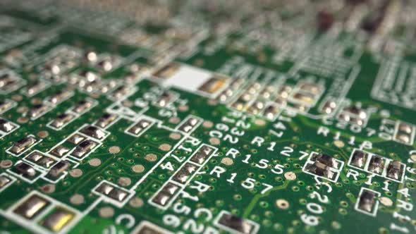 Extreme Closeup of Green Printed Circuit Board Electronics Shot with Dolly alt