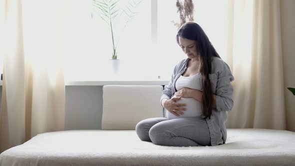Pregnancy Motherhood People Expectation Concept Happy Pregnant Woman Touching Her Tummy in Bed at alt