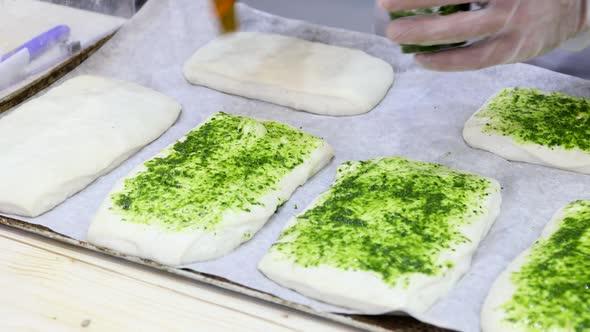 Chef Makes a Pizza and Spreads It with Pesto Sauce