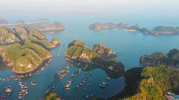 Aerial: sunset clear sky at Cat Ba island and beach with new tourist resort, Halong bay Vietnam alt