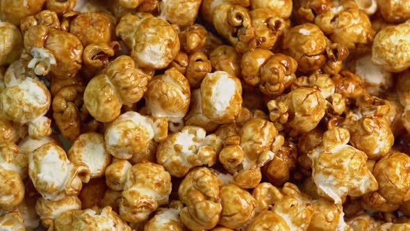 Coffee taste popcorns rotating close up. Caramel popcorn. Healthy food for morning breakfast alt