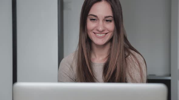 Cute 20s Lady Working at Desk in Trendy Hipster Start Up Office Using Shared Data alt