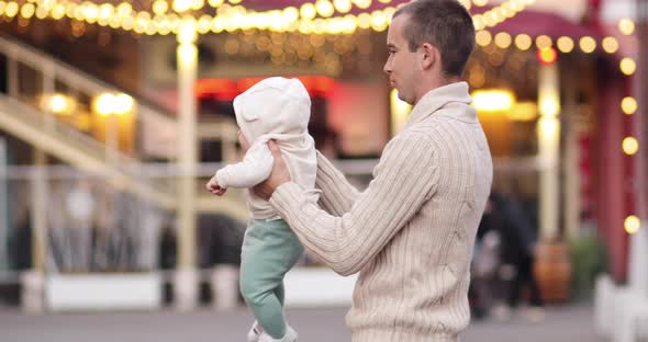 Loving Father with a Baby in Spring Park