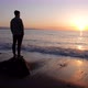 man standing in contemplation in front of the ocea sunset - VideoHive Item for Sale